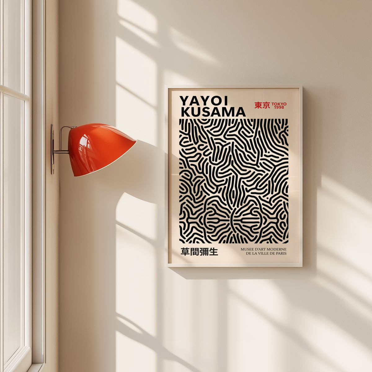 Yayoi Kusama inspired black wavy line pattern print in a white frame by a red wall lamp