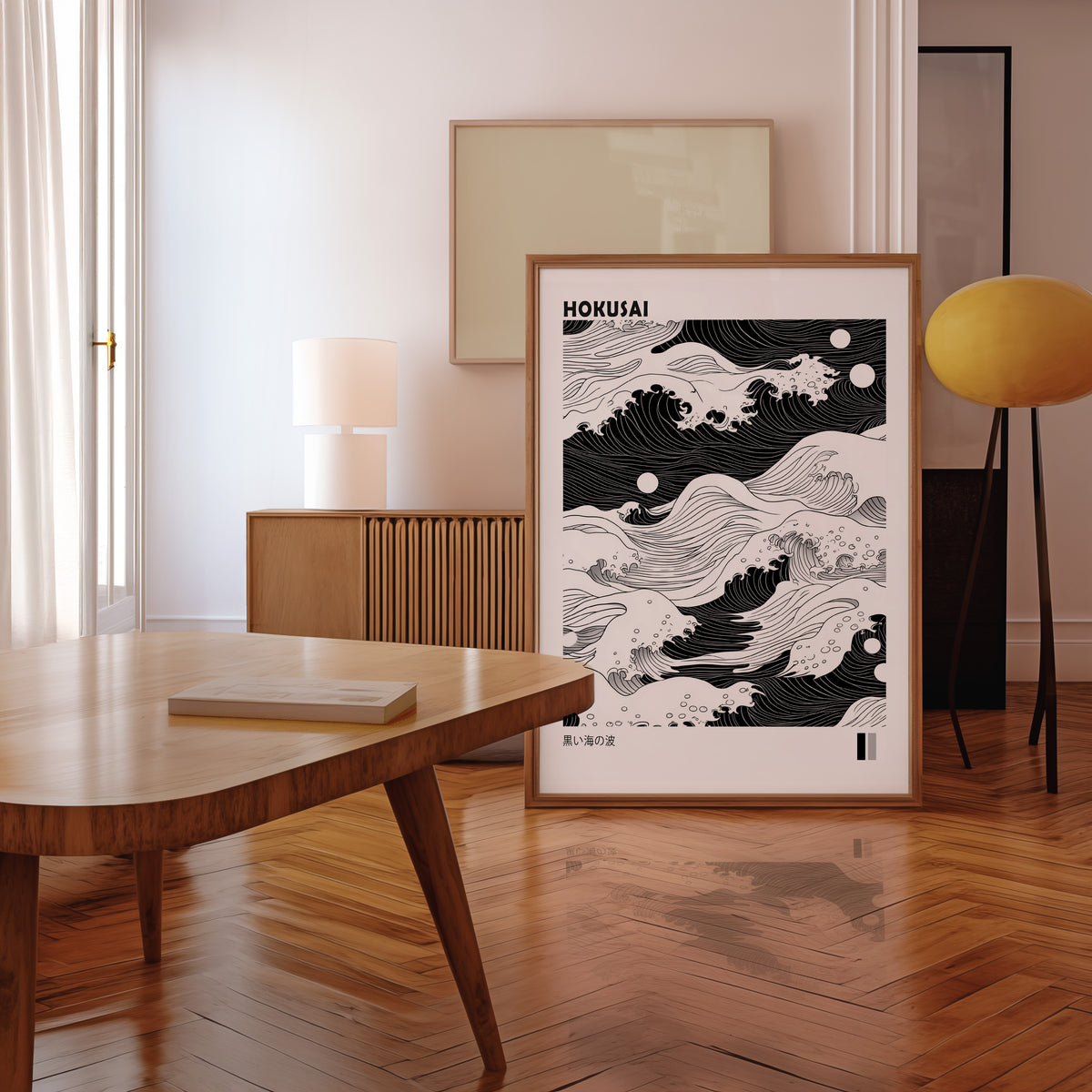 Black sea waves with twin moons print in a walnut frame leaning in a mid-century living room