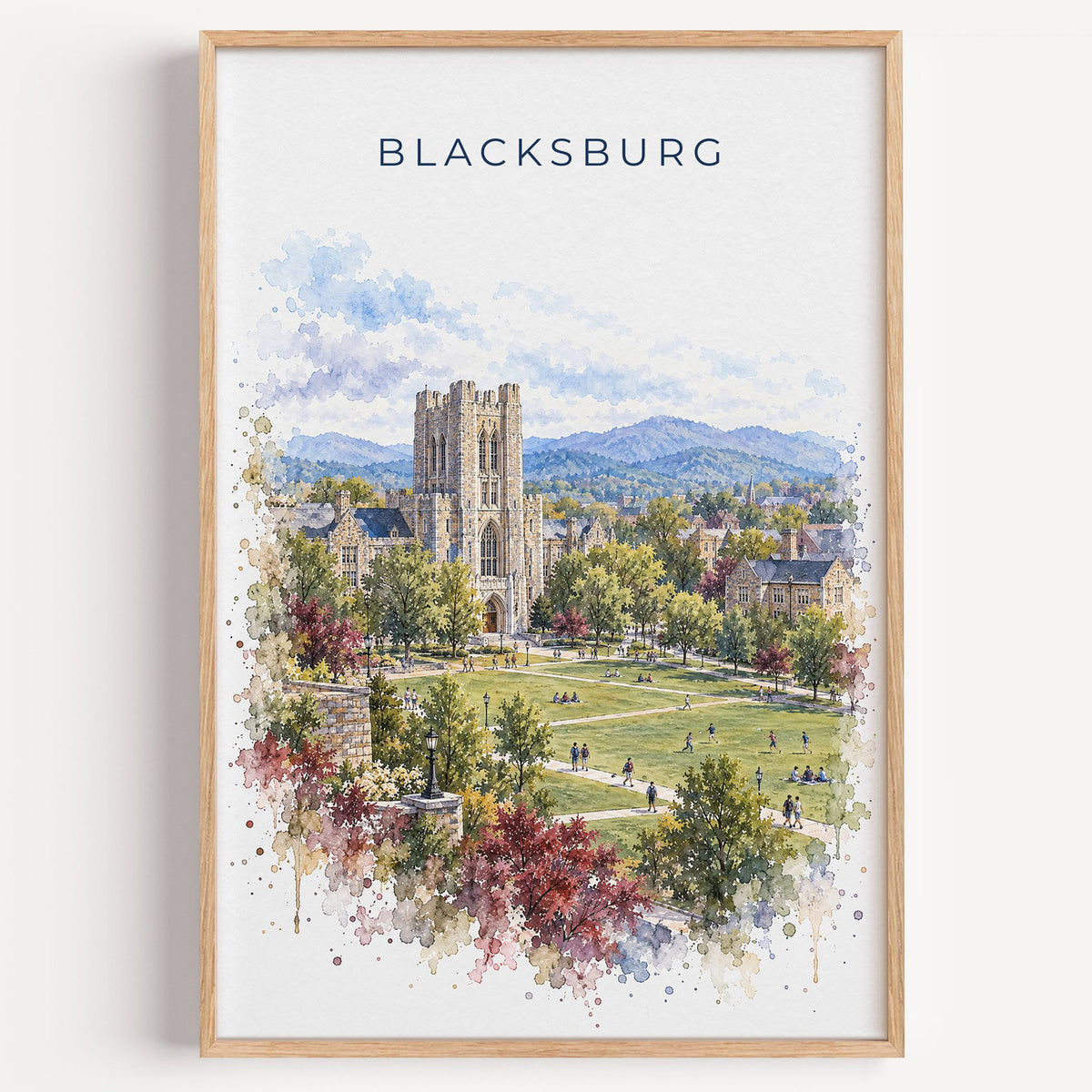 Blacksburg watercolor print in a light oak frame on a plain white wall
