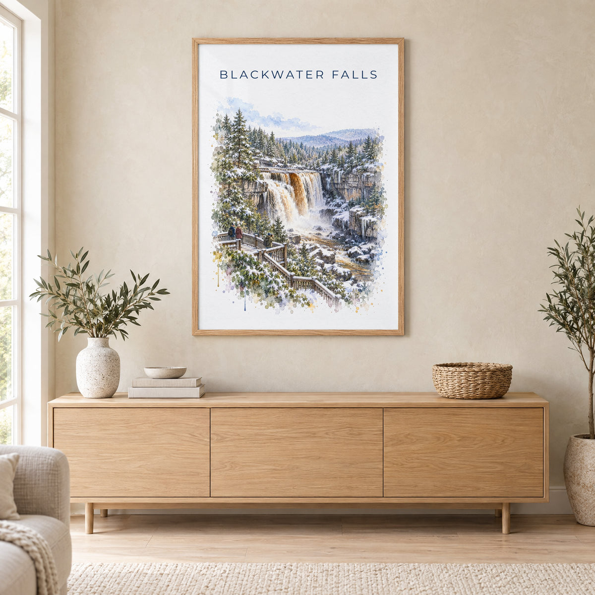 Blackwater Falls State Park watercolor print in an oak frame above a light wood sideboard in a Scandinavian living room