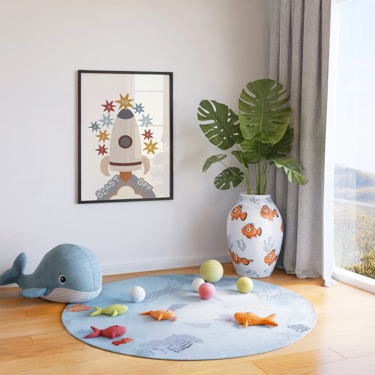 Blast off rocket countdown nursery print in a black frame in a playroom with an ocean rug and whale plush