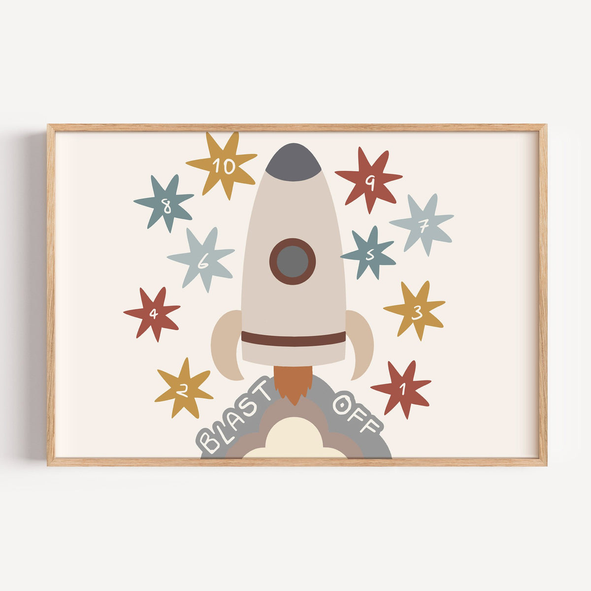 Landscape blast off rocket countdown nursery print in a light oak frame on a plain white wall