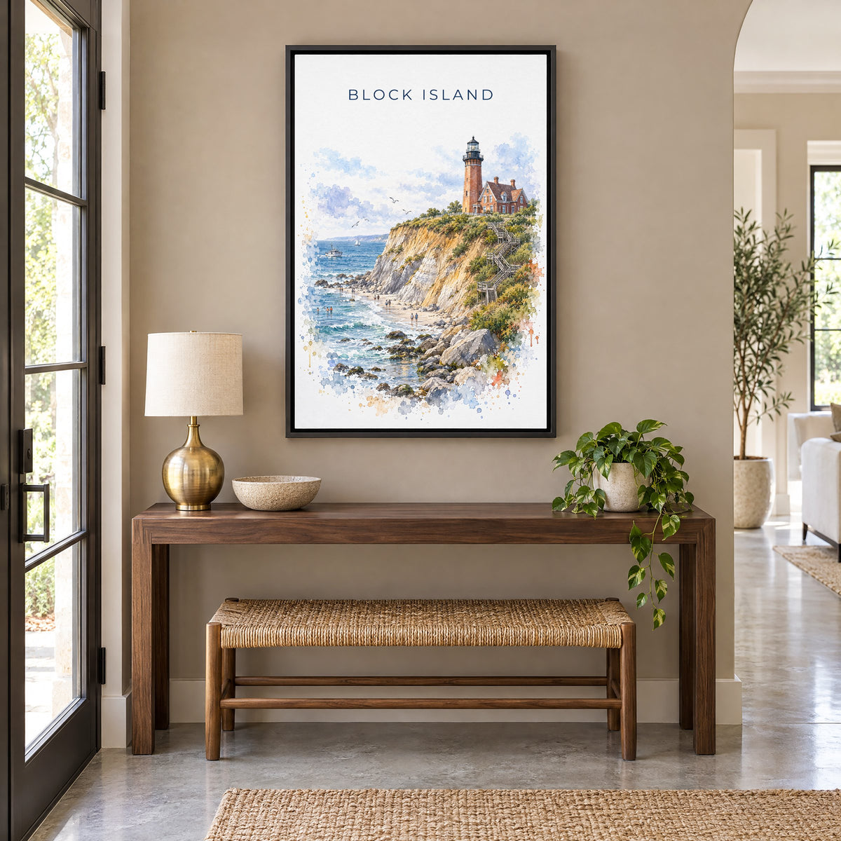 Block Island watercolor print as a black floater canvas above a walnut console and woven bench in an entryway
