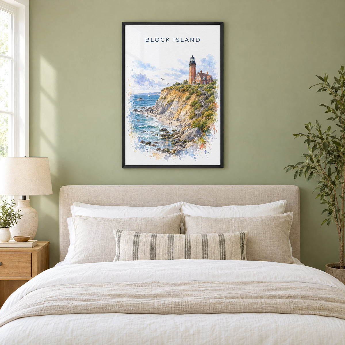 Block Island watercolor print in a black frame above an upholstered headboard in a sage green bedroom