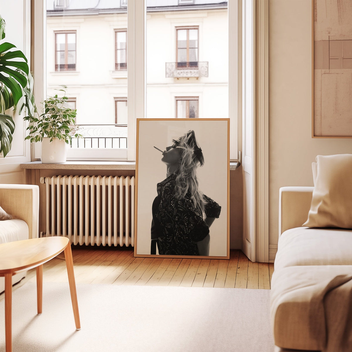 Backlit model in leather cap and sequin jacket print in an oak frame leaning by a French window in a living room