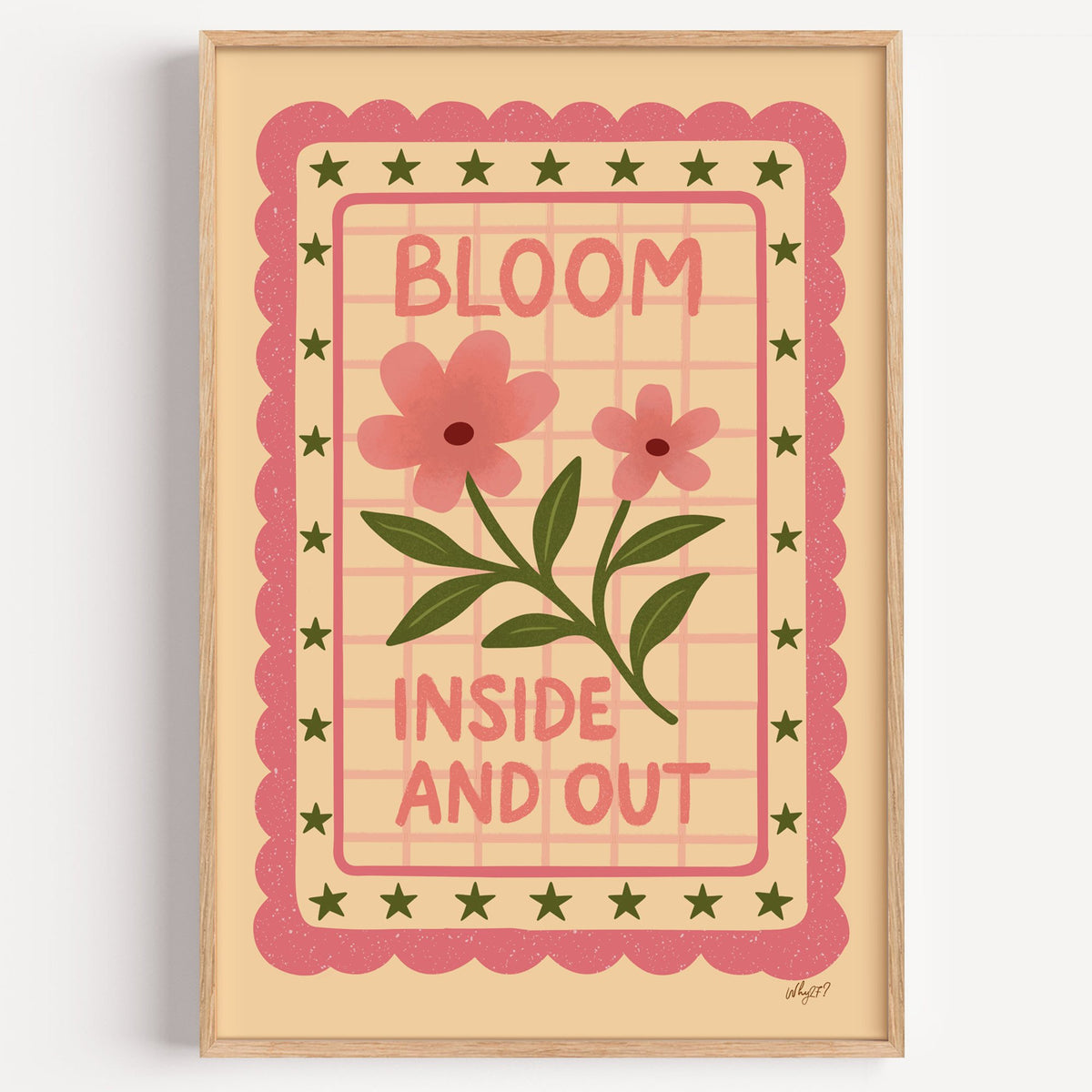Bloom inside and out pink floral nursery print in a light oak frame on a plain white wall