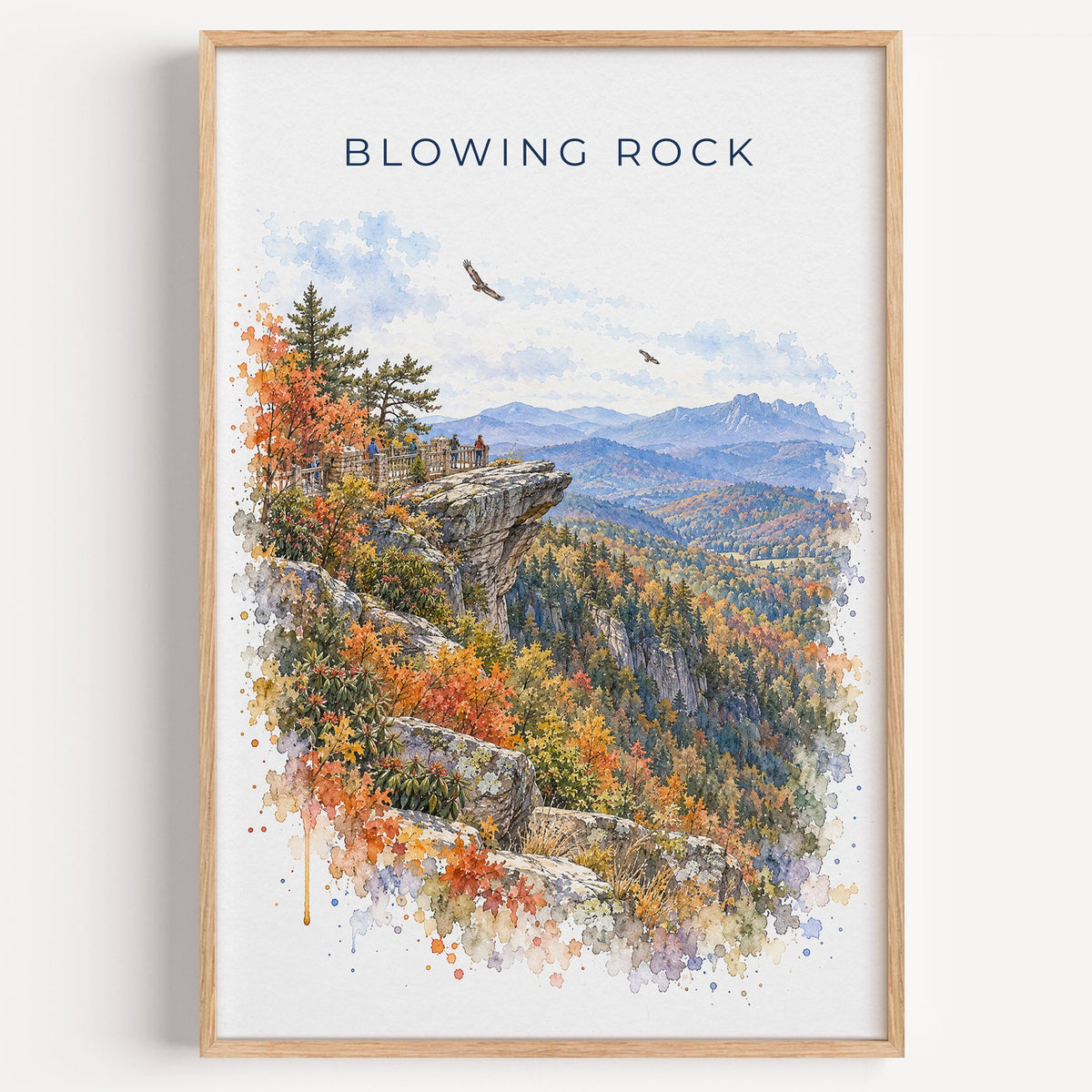 Blowing Rock watercolor print in a light oak frame on a plain white wall