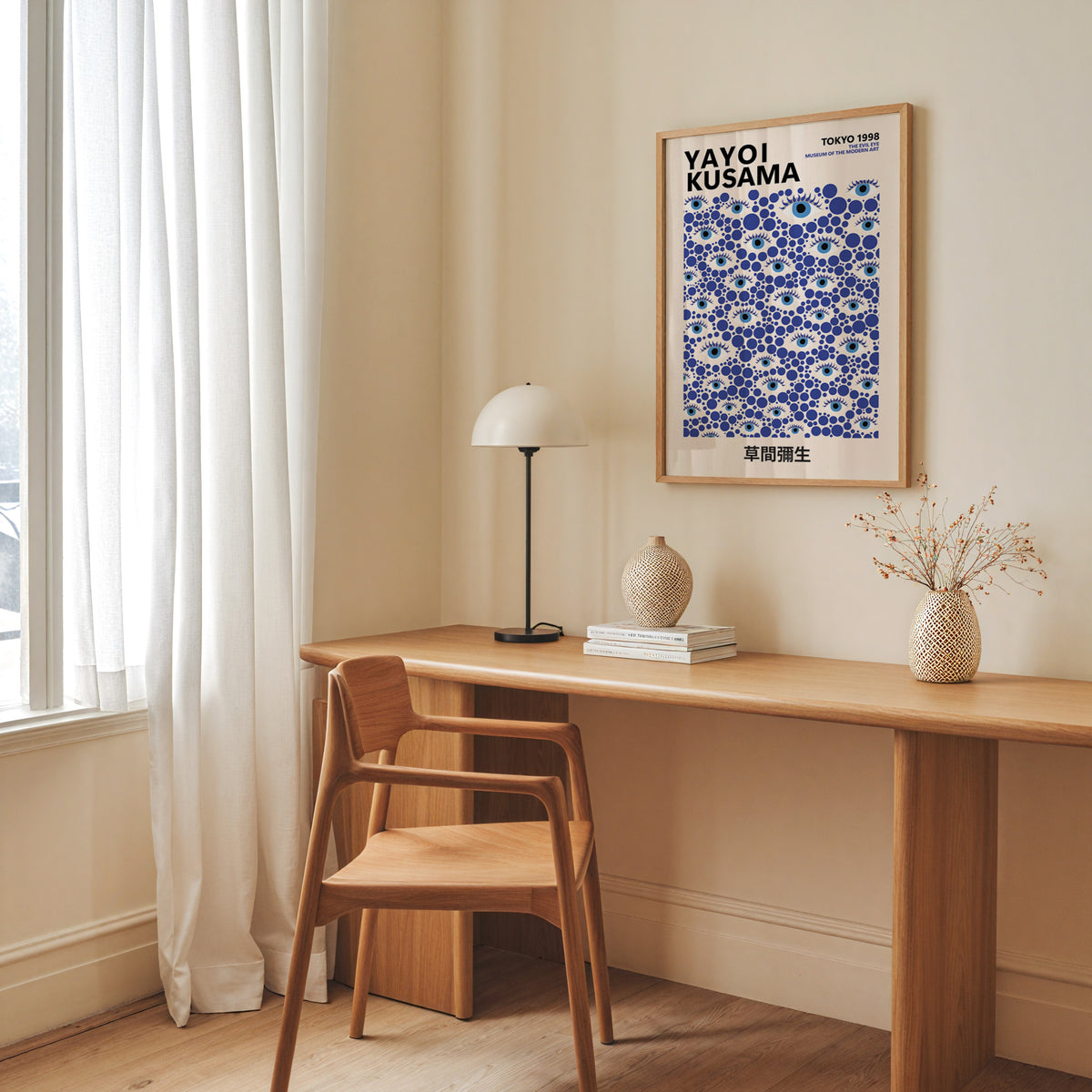 Yayoi Kusama inspired blue evil eye dot print above a desk with a dome lamp