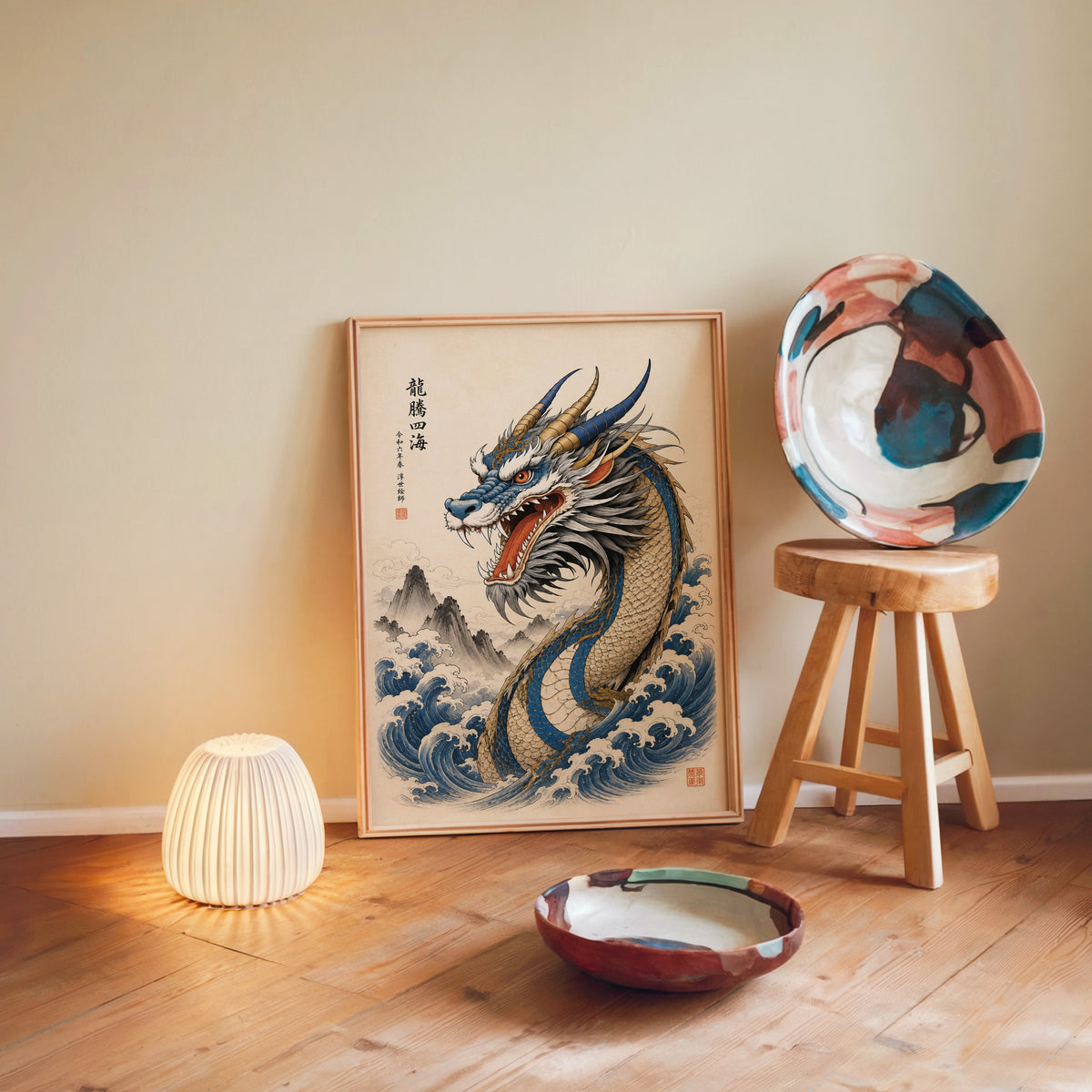 Blue dragon great waves poster in a light wood frame leaning on a wooden floor by a glowing lamp and stool