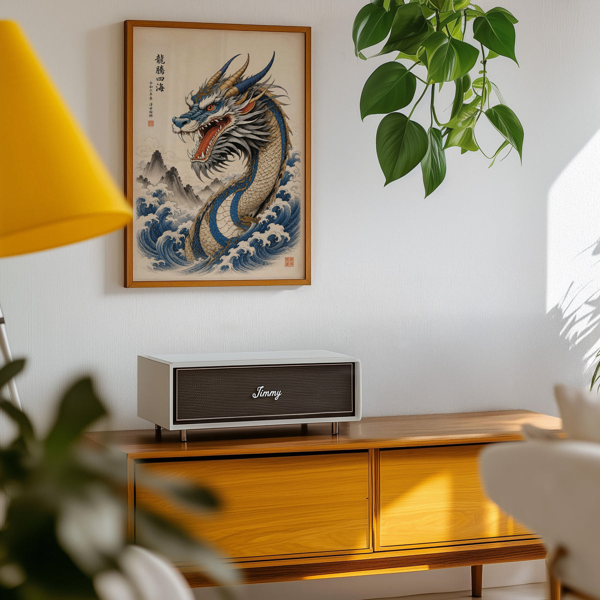 Blue dragon great waves poster in an oak frame above a teak mid-century sideboard with trailing pothos