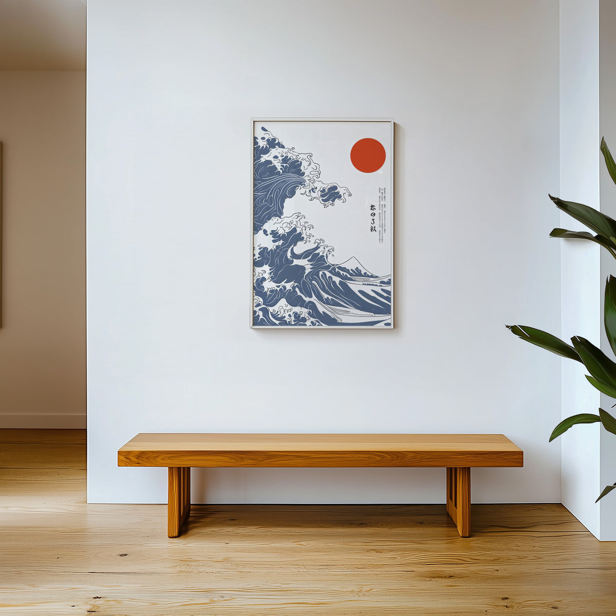 Blue Great Wave with red sun print shown in a white frame above a wooden entryway bench