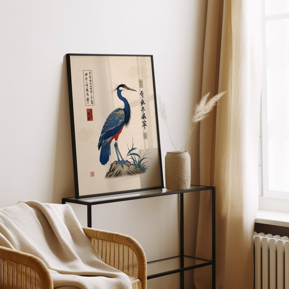 Blue crested bird on rock poster in a black frame leaning on a glass console beside pampas grass