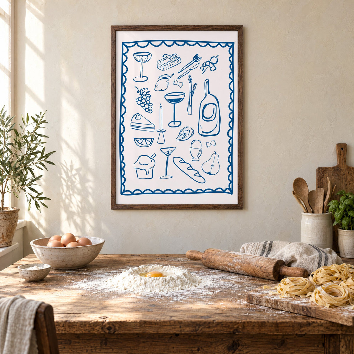 Blue line dinner party scalloped print in a walnut frame above a rustic table set for making fresh pasta