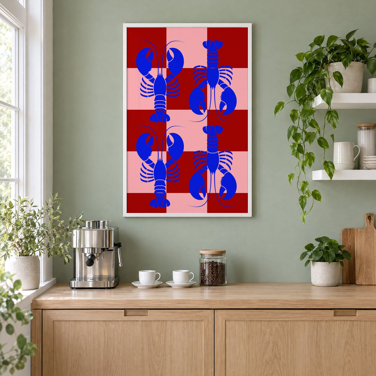 Blue lobster red pink checker print in a white frame on a sage green coffee nook wall above an espresso machine