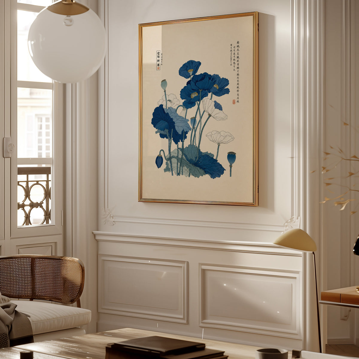 Blue and white poppies poster shown in a gold frame on a paneled wall in a Parisian-style living room