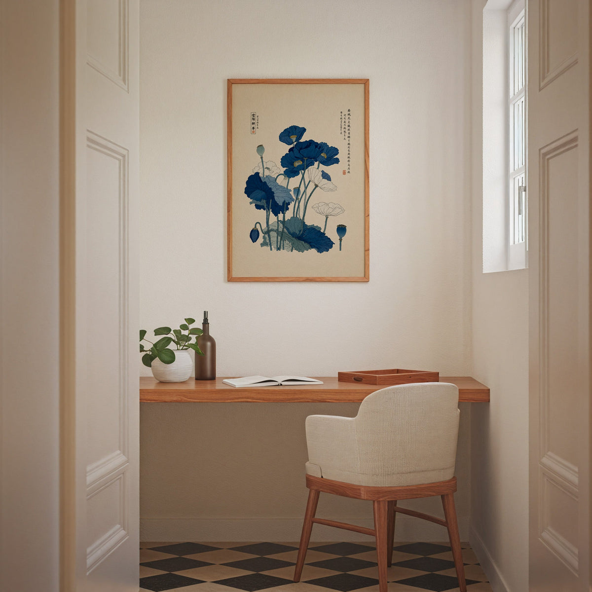 Blue and white poppies poster in an oak frame above a wall-mounted desk in a home office nook
