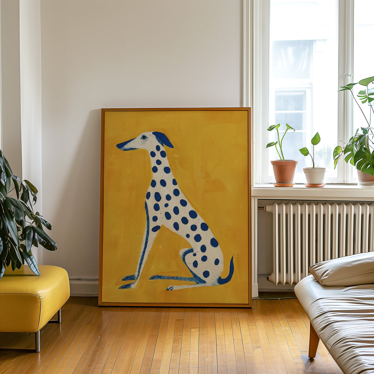 Blue and yellow dog print in an oak frame leaning beside a yellow leather bench