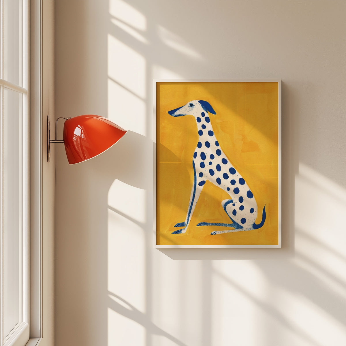 Blue spotted dog print in a white frame beside a red wall sconce