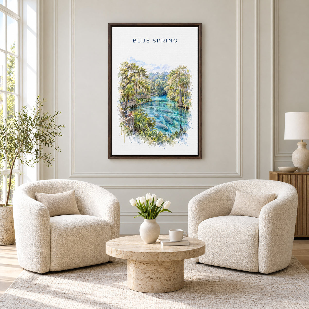 Blue Spring State Park watercolor print as an espresso floater canvas above two boucle armchairs in a hotel lounge