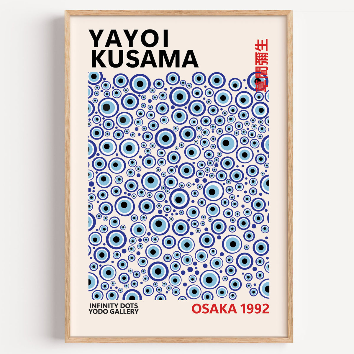 Yayoi Kusama inspired turquoise evil eye print in a wood frame on a plain wall