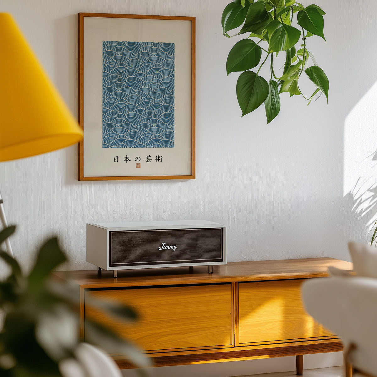 Blue wave line pattern poster in an oak frame above a teak mid-century sideboard with trailing pothos
