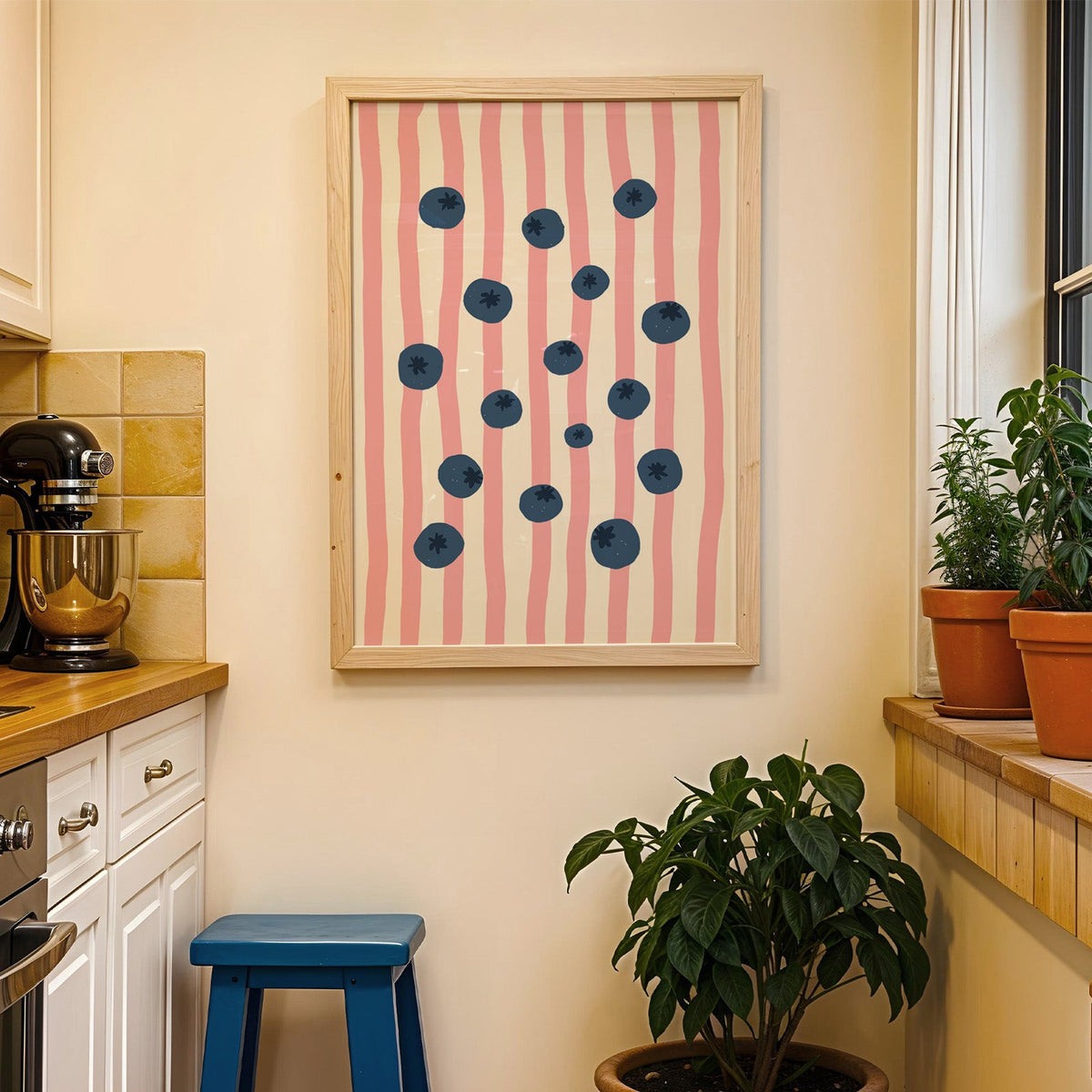 Blueberry stripe print in a wood frame on a yellow tiled kitchen wall