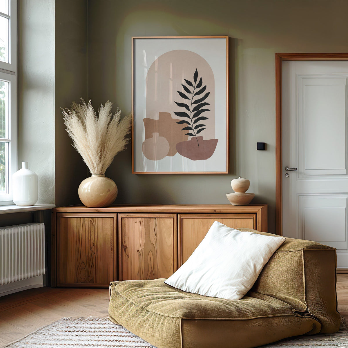 Blush arch and three vases boho botanical print in an oak frame on an olive green wall above a wood sideboard with pampas