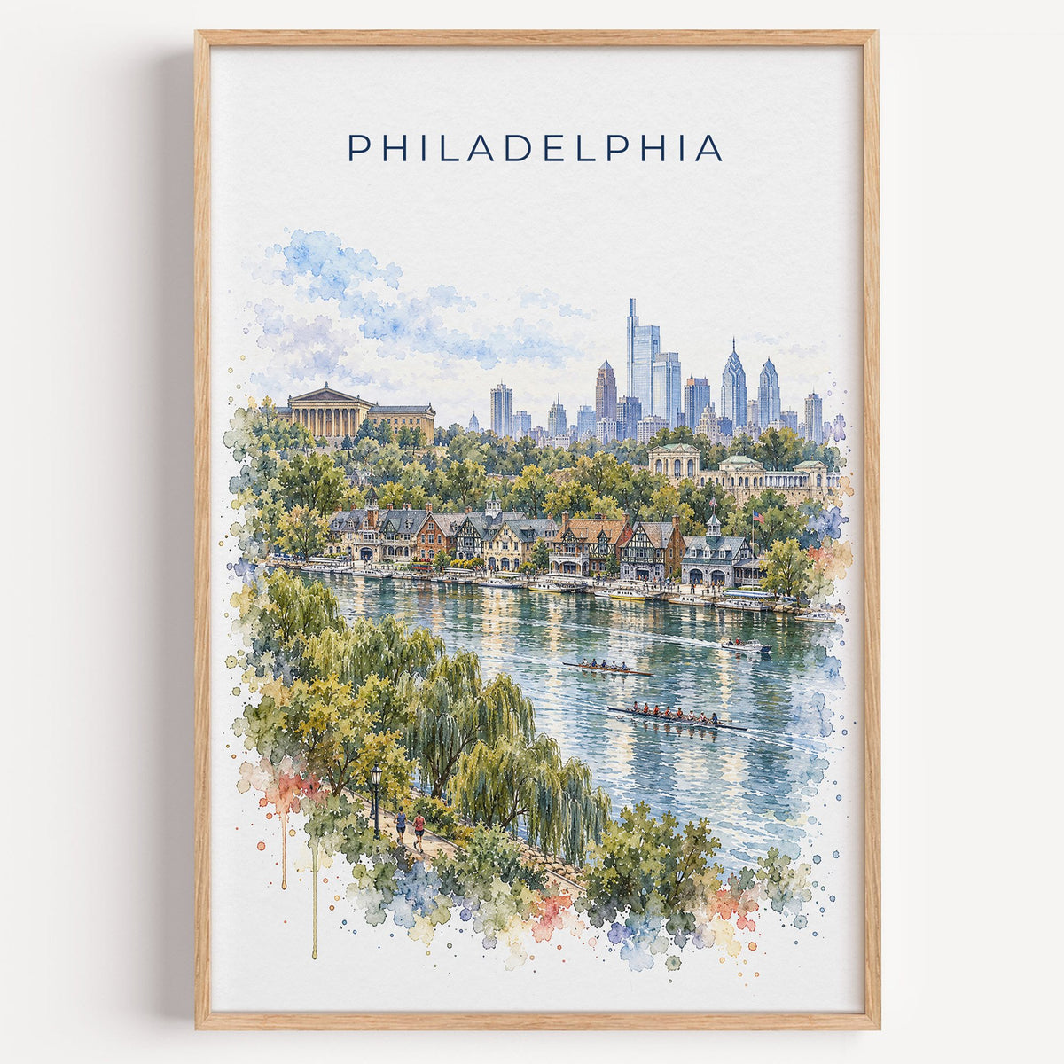 Boathouse Row Philadelphia watercolor print in a light oak frame on a plain white wall