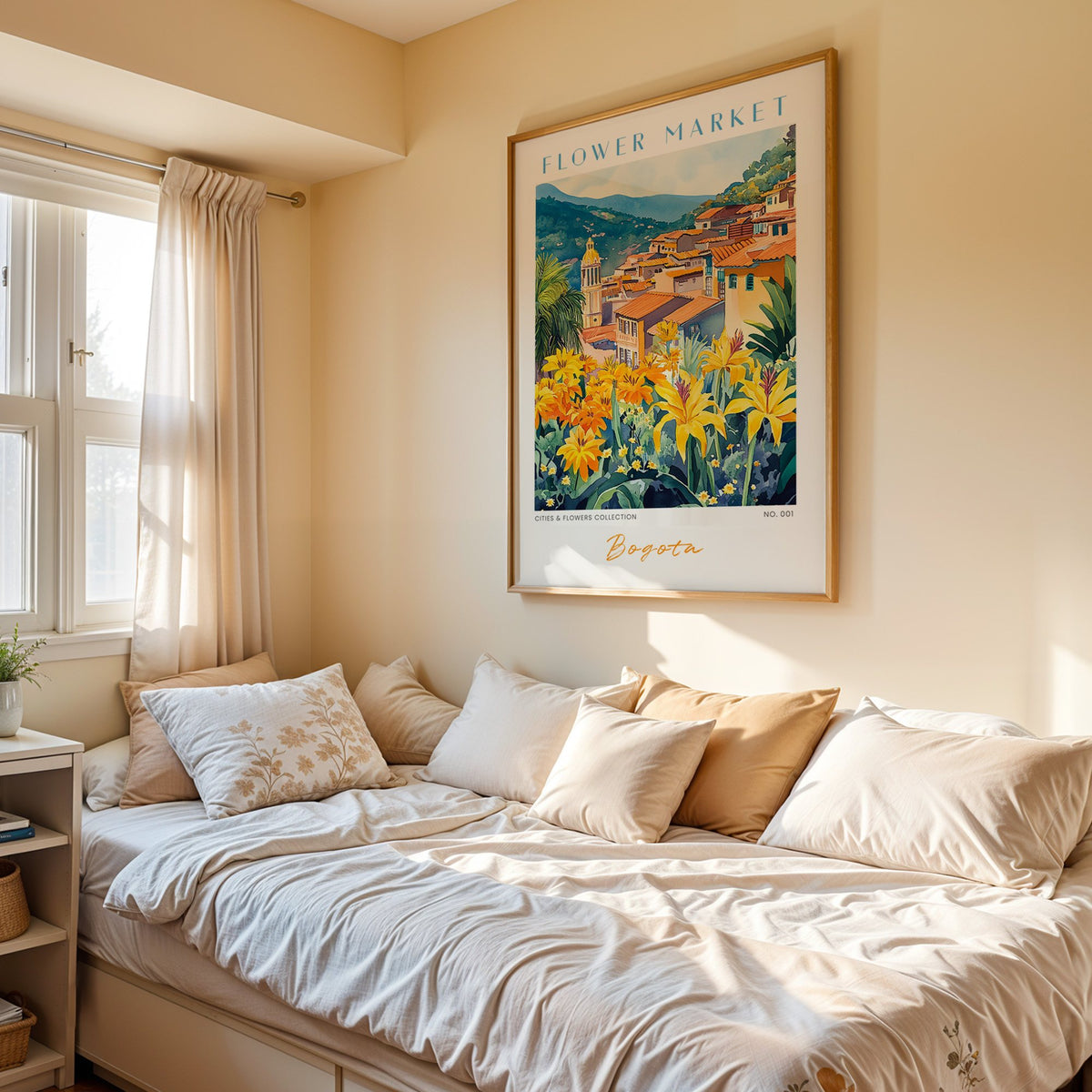 Bogota flower market print in an oak frame above a cream daybed in a sunny bedroom