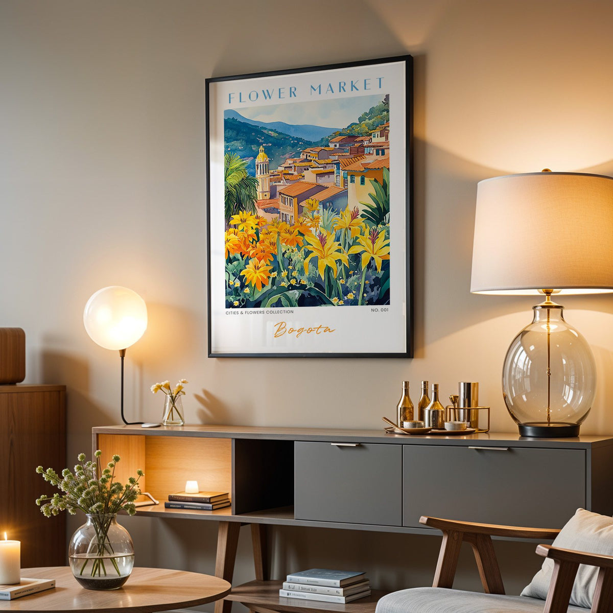 Bogota flower market print in a black frame above a grey media console with a glass table lamp