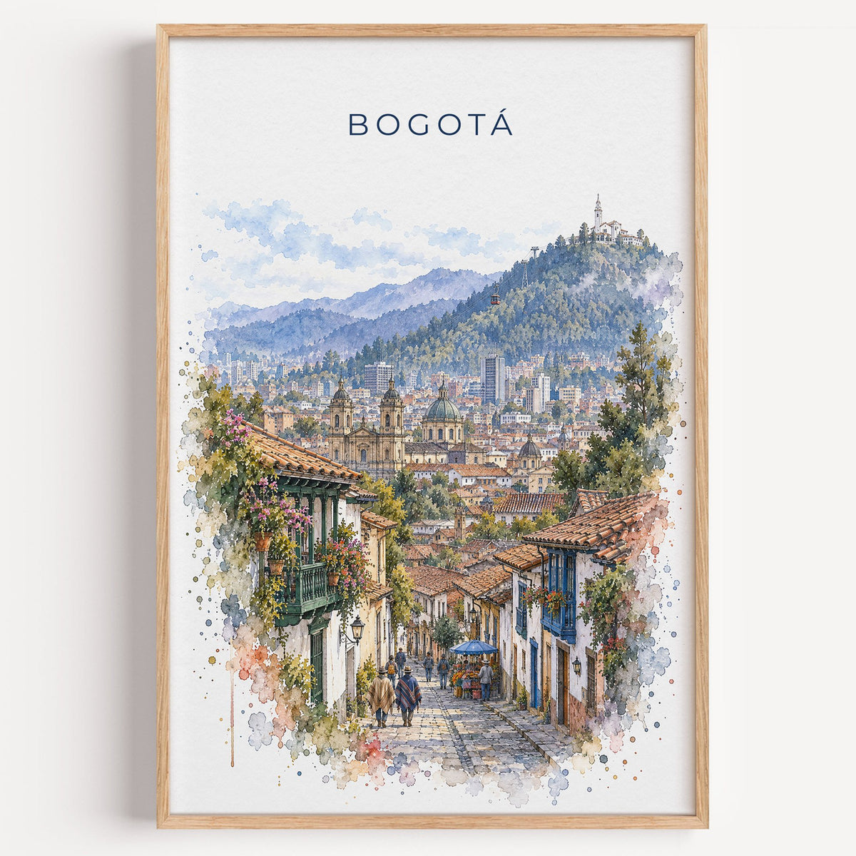 Bogotá watercolor print in a light oak frame on a plain white wall