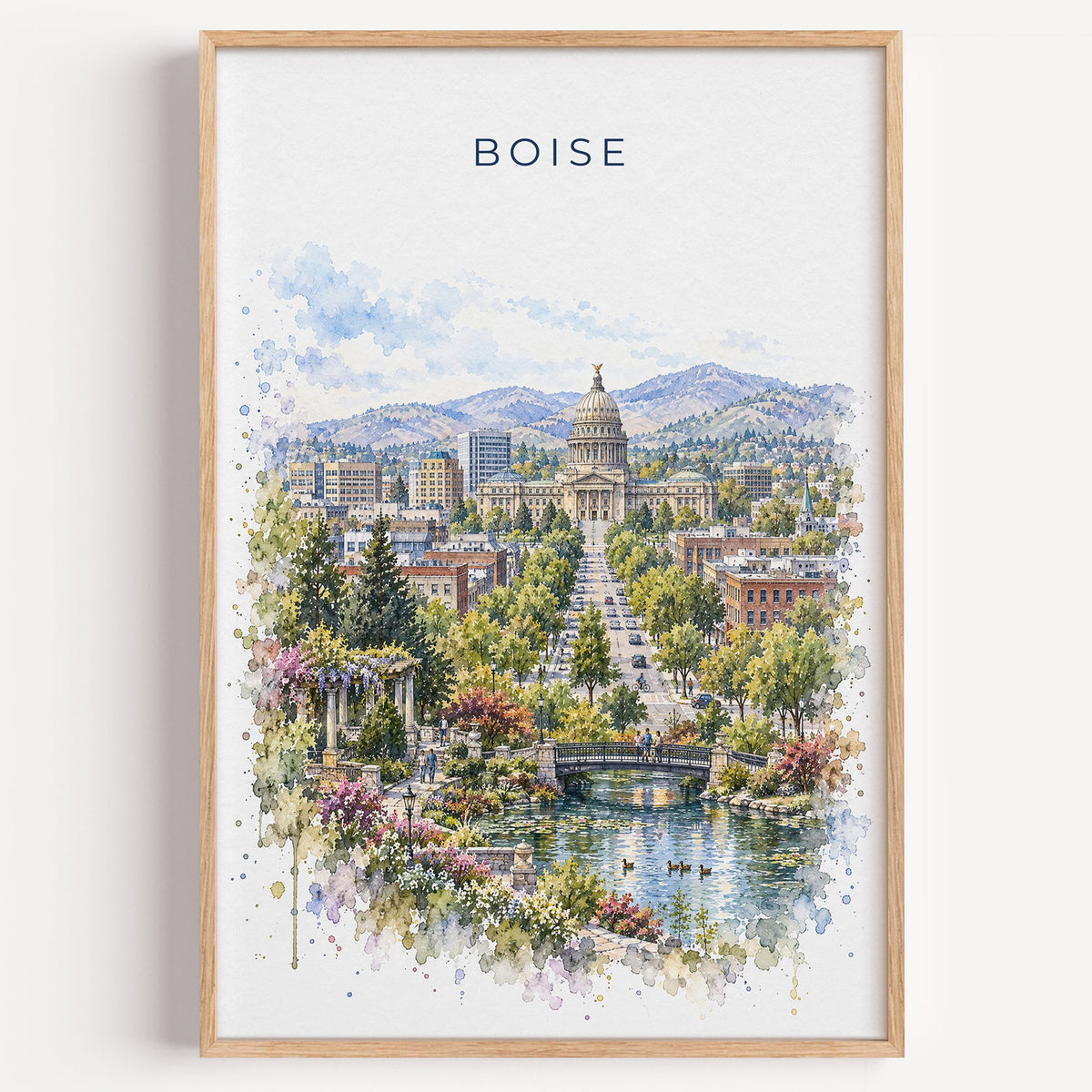 Boise watercolor print in a light oak frame on a plain white wall