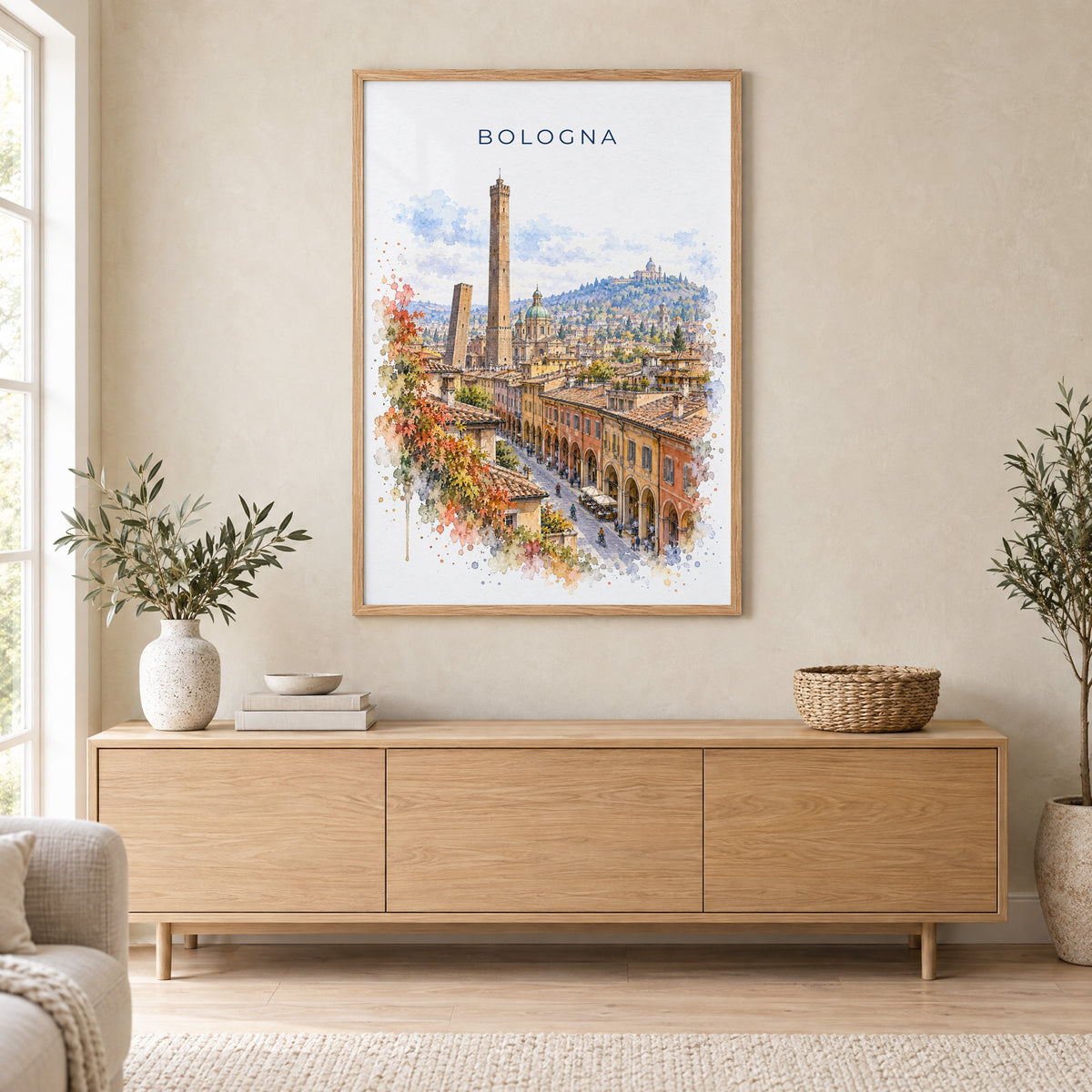 Bologna watercolor print in an oak frame above a light wood sideboard in a Scandinavian living room