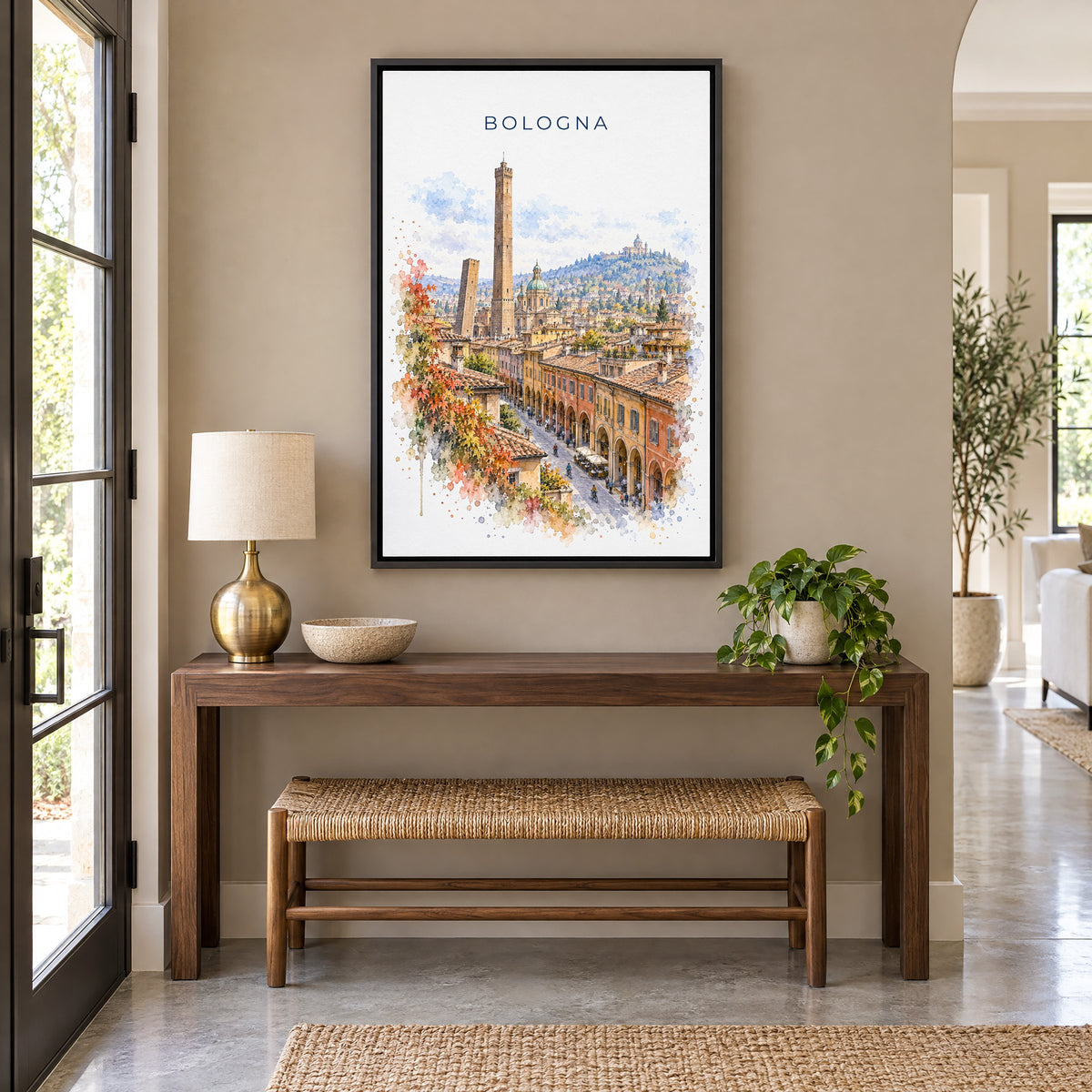 Bologna watercolor print as a black floater canvas above a walnut console and woven bench in an entryway