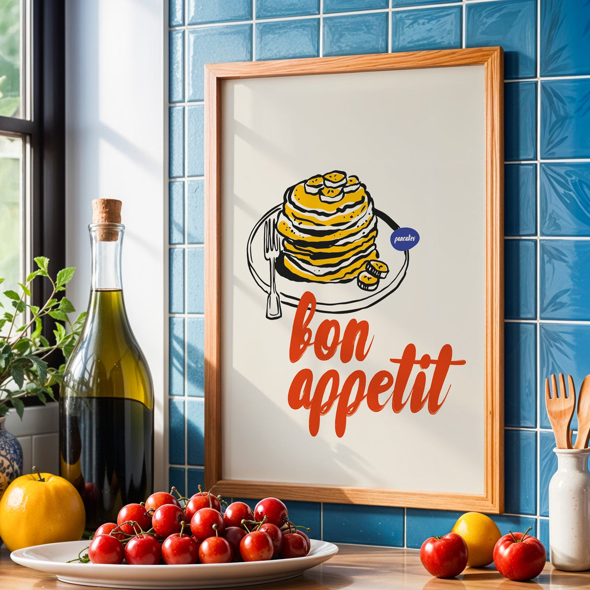 Bon Appetit pancakes print in an oak frame against blue tiles with olive oil