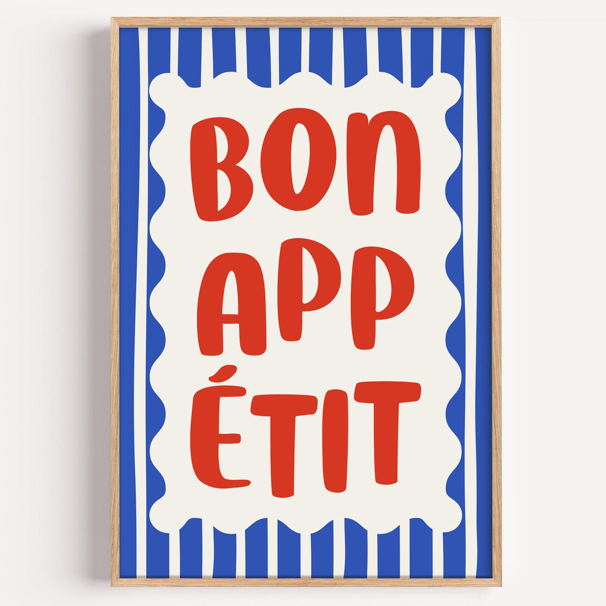 Bon appetit stripe print in a light oak frame on a plain white wall