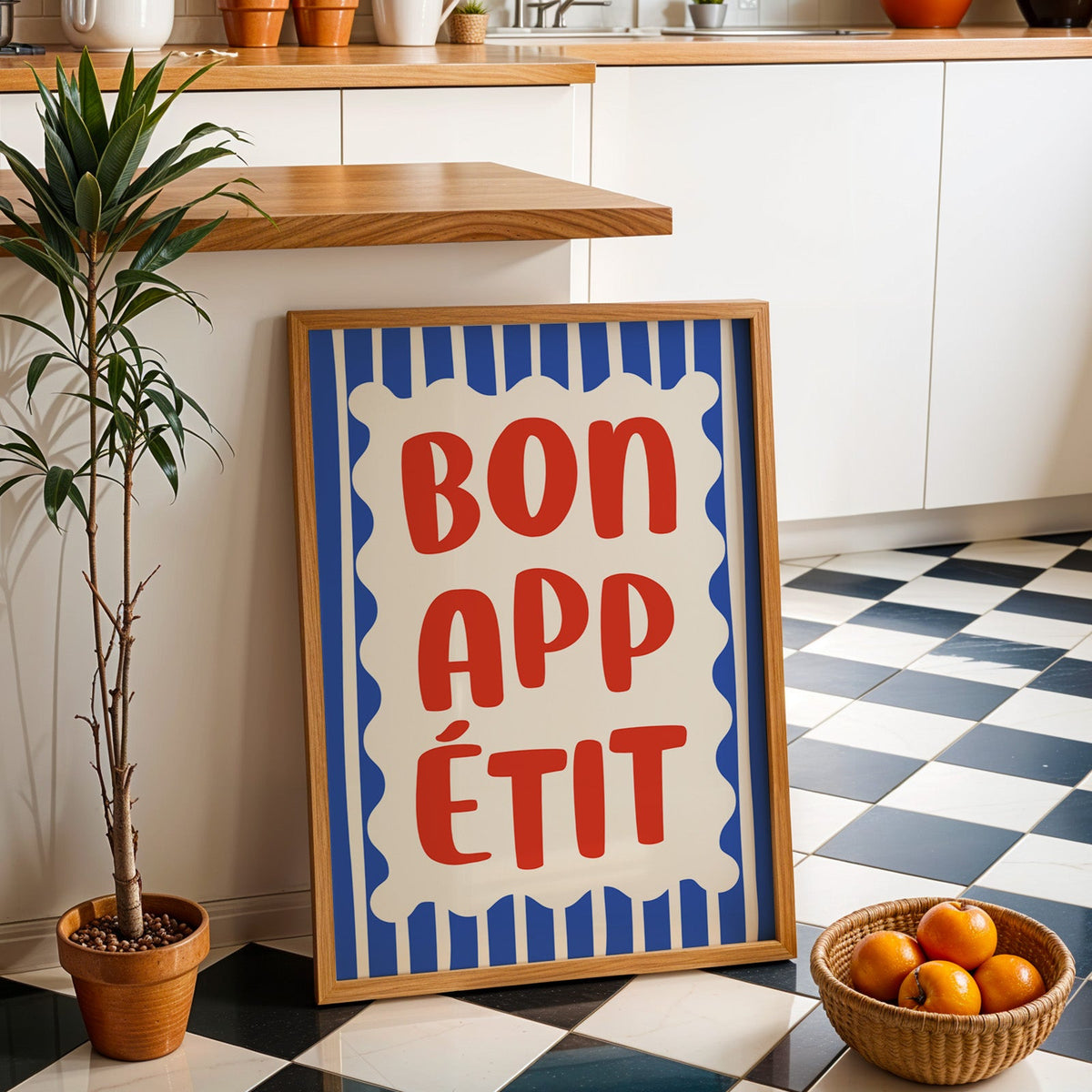 Bon appetit print in an oak frame by a kitchen island and checkered floor