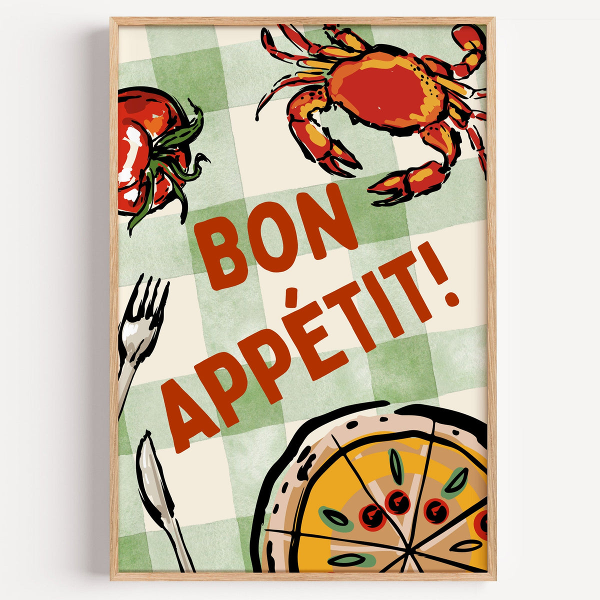 Bon Appetit crab and pizza print in a light oak frame on a plain white wall