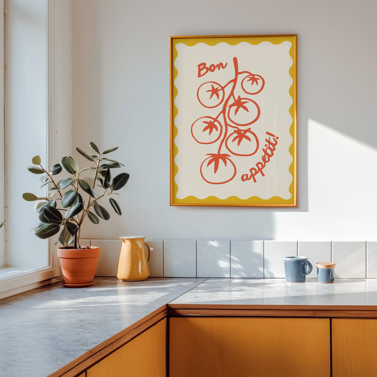 Tomato vine print shown in a gold frame above a marble counter with a yellow ceramic jug