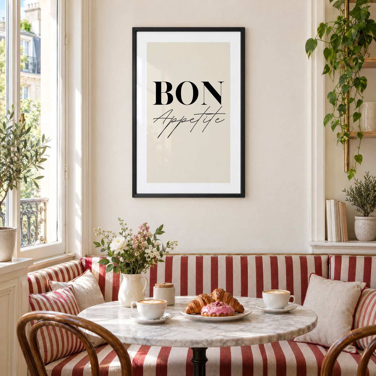BON Appetite serif and script print in a black frame above a striped cafe breakfast nook with cappuccino and pastries