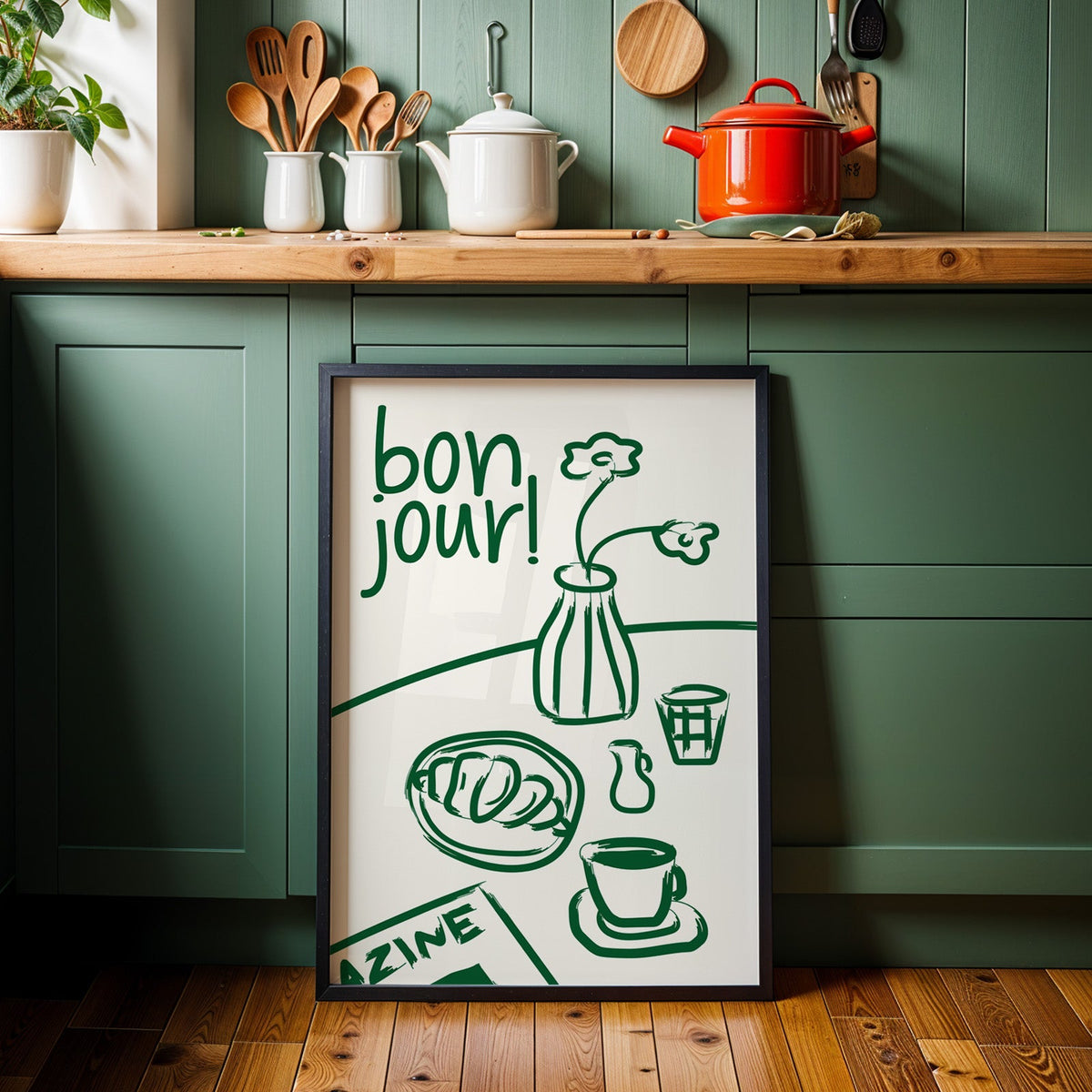 Bon jour breakfast print in a black frame against sage green kitchen cabinets