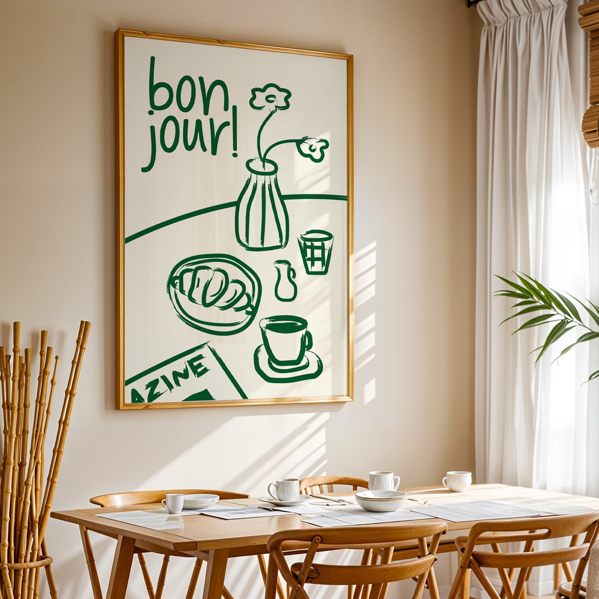 Bon jour breakfast print in a gold frame above a sunlit breakfast table