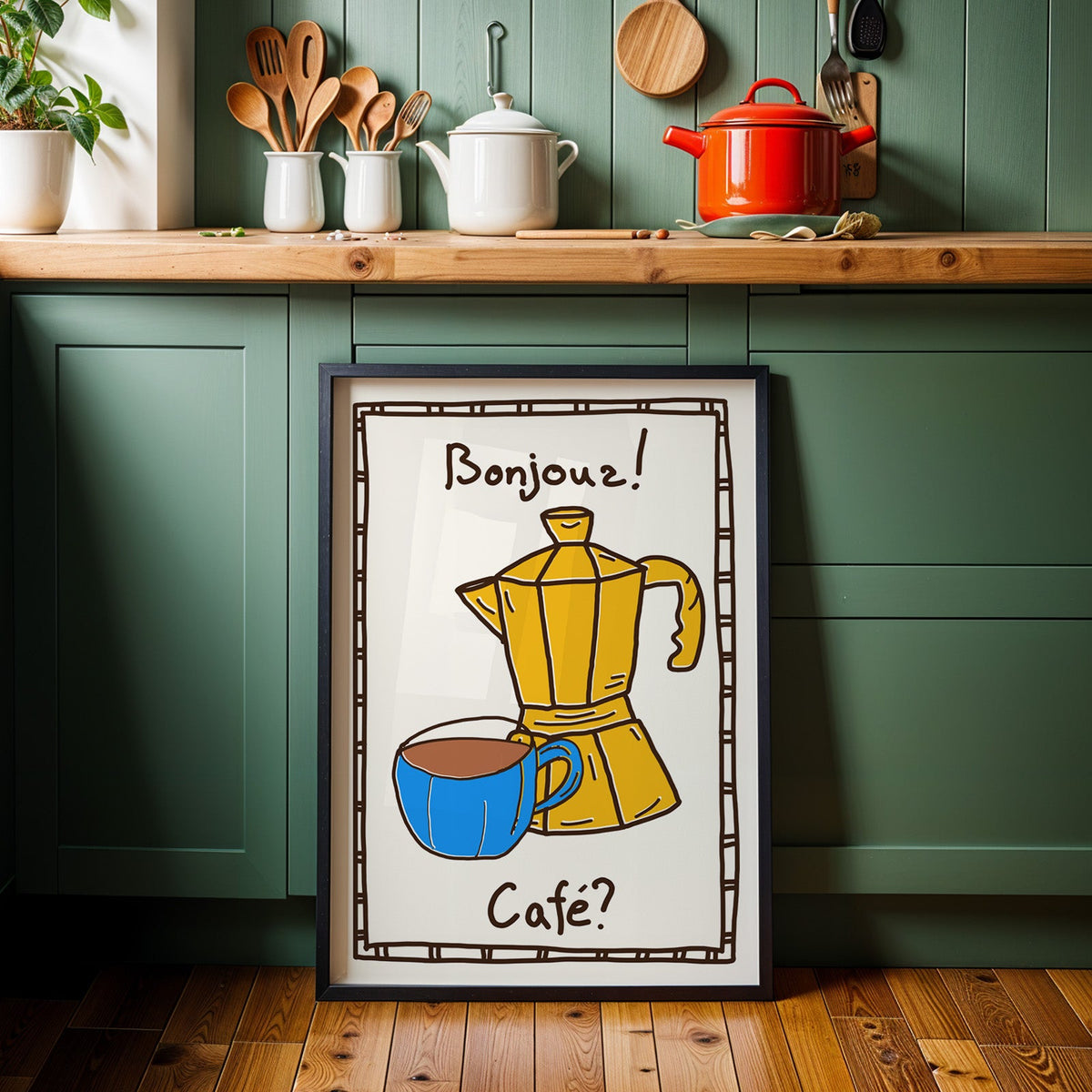 Bonjour cafe moka pot print in a black frame against sage green kitchen cabinets