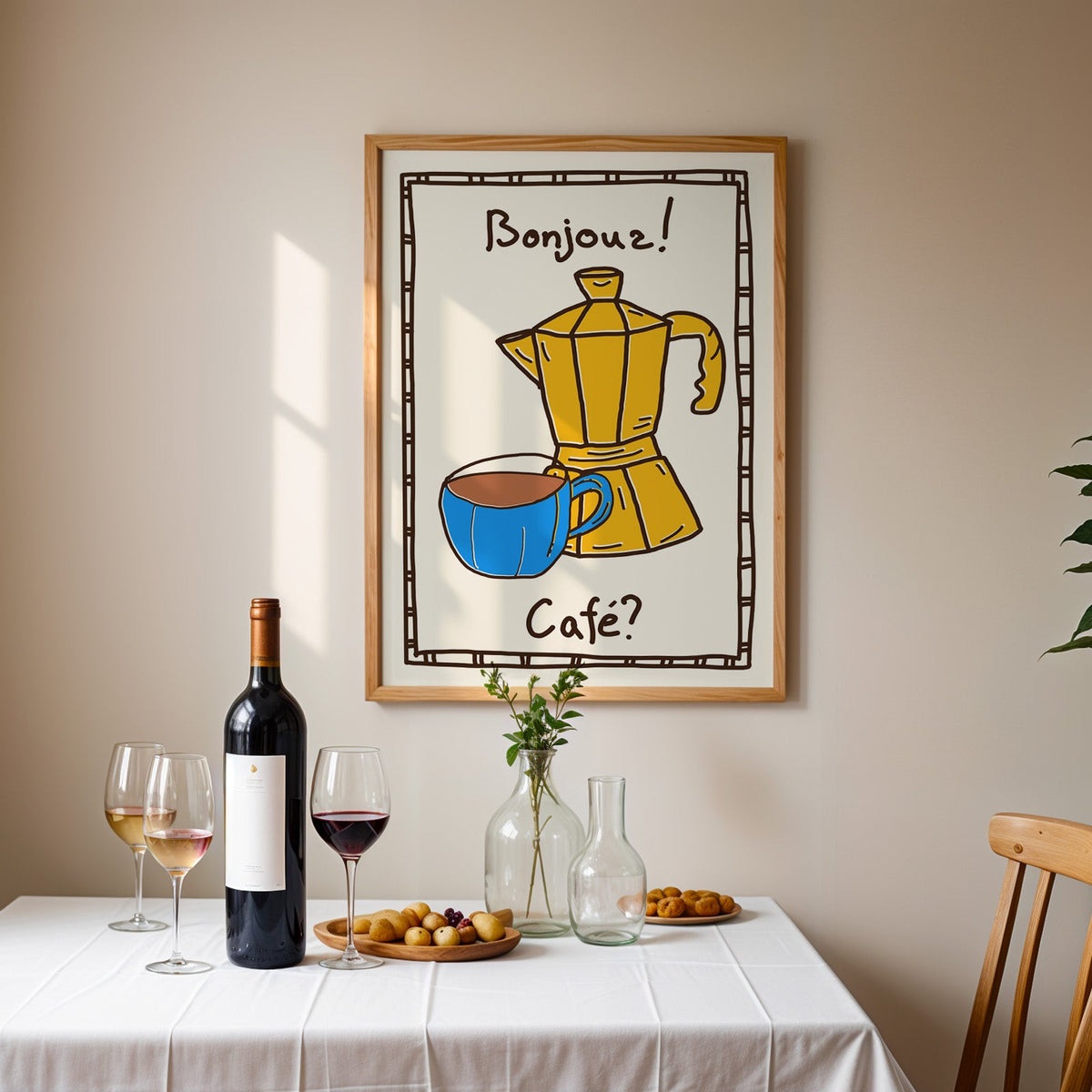 Bonjour cafe moka pot print in an oak frame above a table laid with wine and glasses