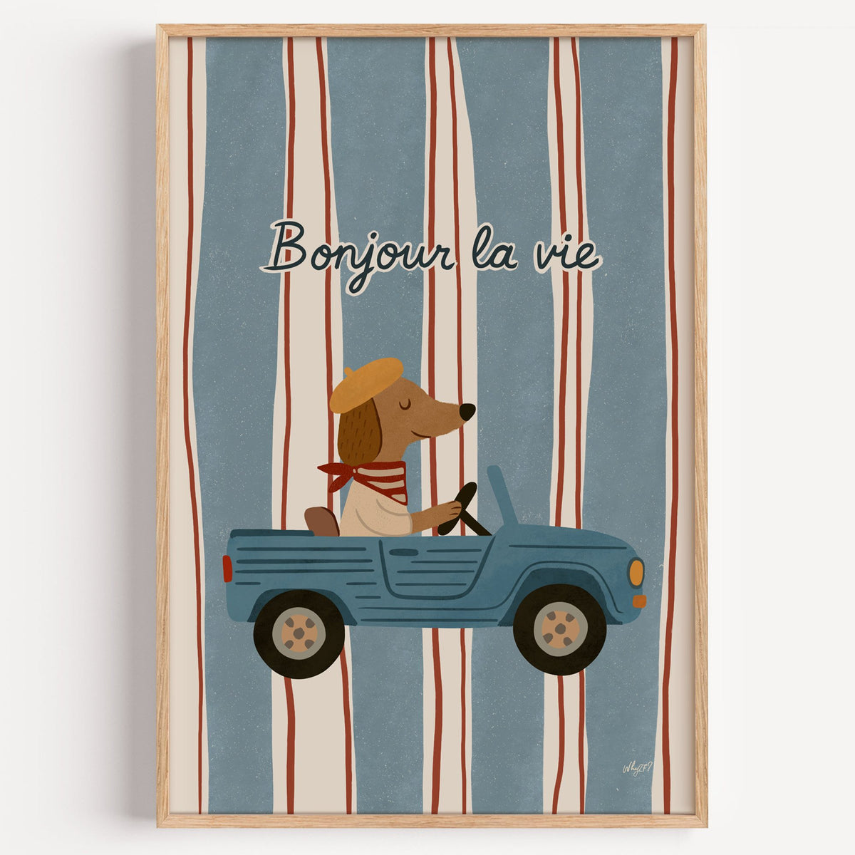 Dog driving car with french script nursery print in a light oak frame on a plain white wall