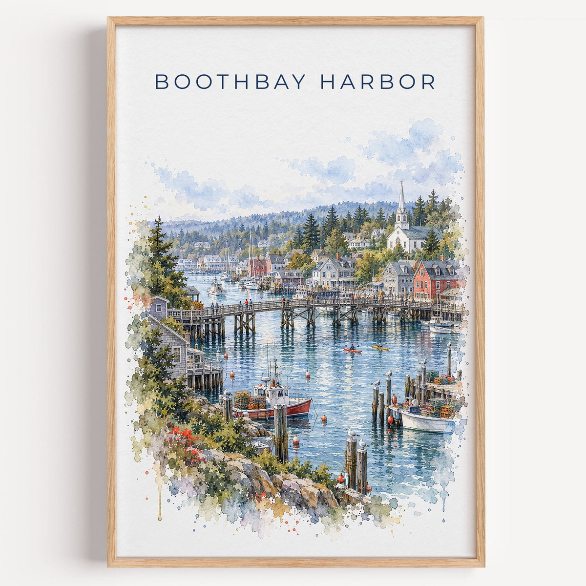 Boothbay Harbor watercolor print in a light oak frame on a plain white wall