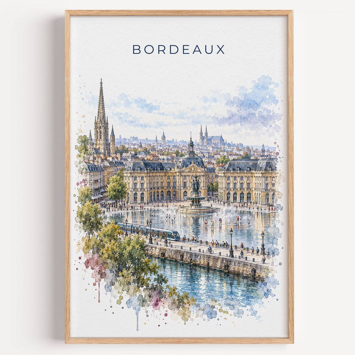 Bordeaux watercolor print in a light oak frame on a plain white wall