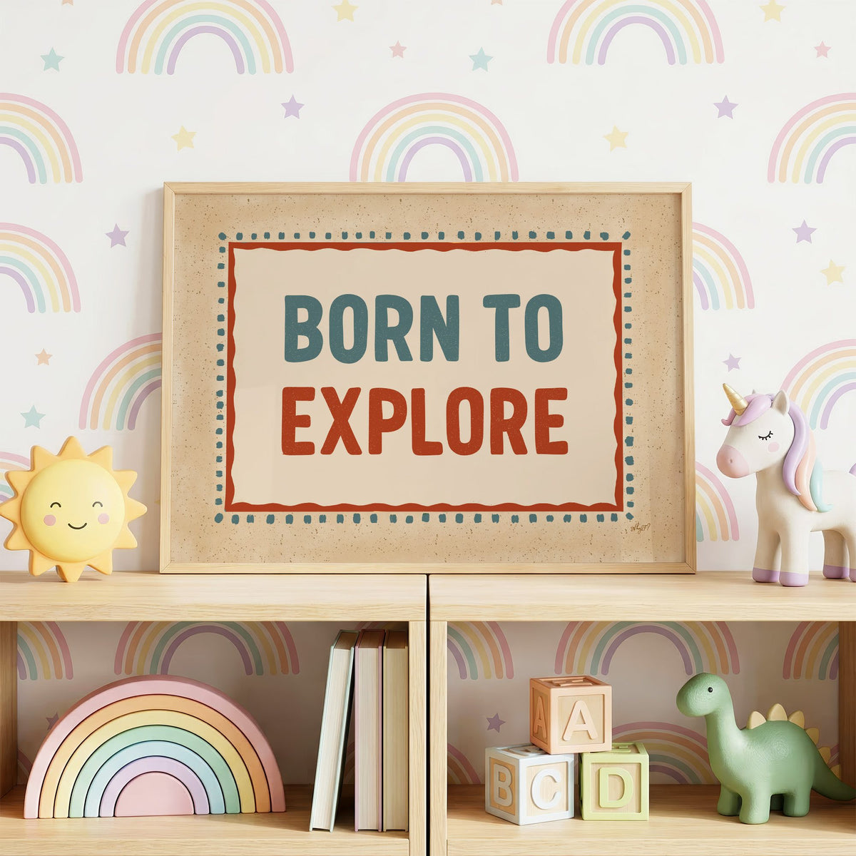 Born to explore retro quote nursery print in an oak frame on a toy shelf against rainbow wallpaper