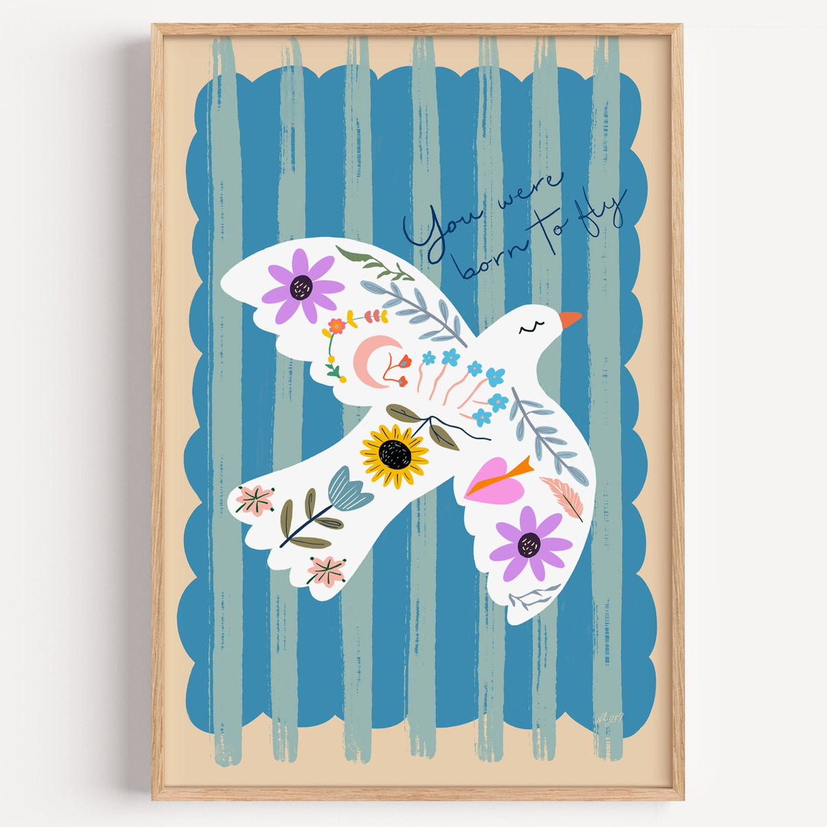 White dove covered in flowers nursery print in a light oak frame on a plain white wall