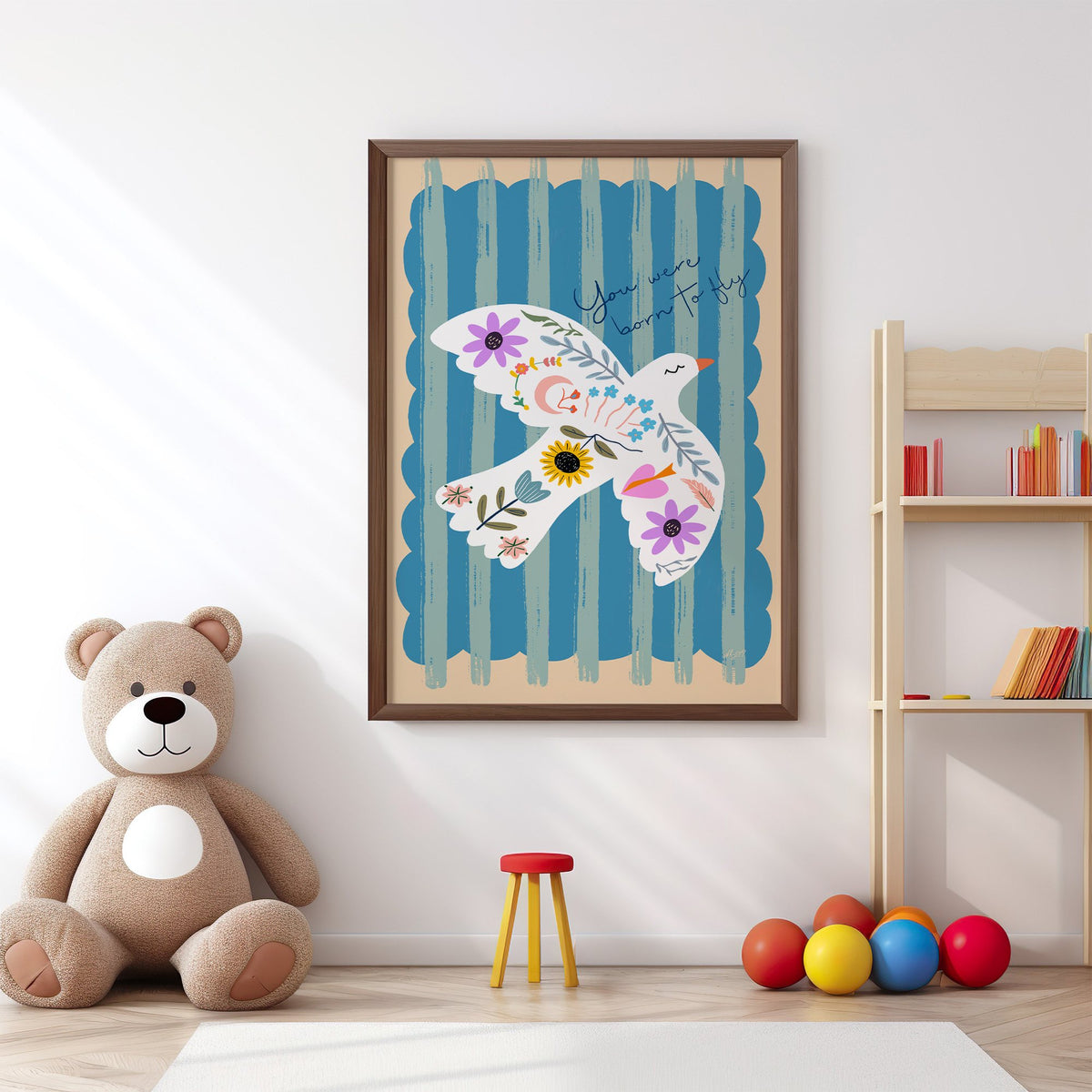 White dove covered in flowers nursery print in a walnut frame above a big teddy bear by a bookshelf